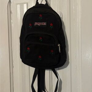 Jansport Black Backpack with Red Floral Design